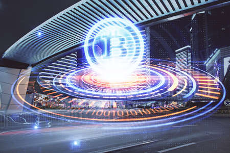 Multi exposure of cryptocurrency theme hologram drawing and city veiw background. Concept of blockchain and bitcoin.の写真素材