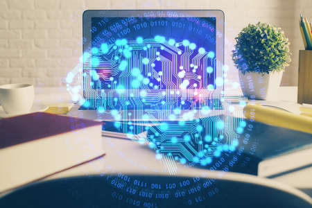 Double exposure of work space with computer and human brain drawing hologram. Brainstorm concept.
