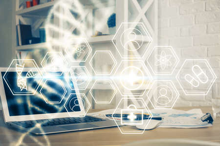 Desktop computer background and DNA drawing. Double exposure. Science concept.の写真素材