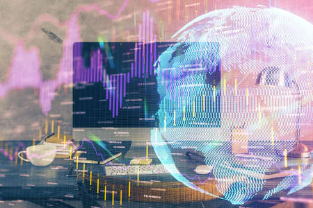 Double exposure of forex graph and work space with computer. Concept of international online trading.の写真素材