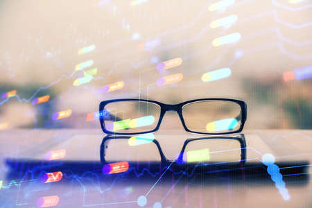 Data tech hologram with glasses on the table background. Concept of technology. Double exposure.の写真素材