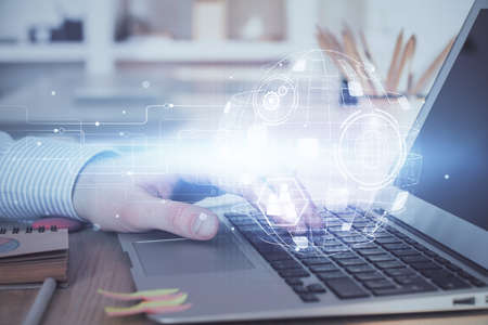 Social network theme hologram with businessman working on computer on background. Concept of world...