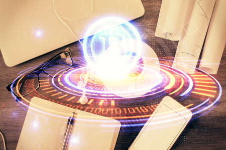 Blockchain theme hologram drawings over computer on the desktop background. Top view. Multi...