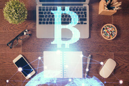 Blockchain theme hologram drawings over computer on the desktop background. Top view. Double exposure.の写真素材