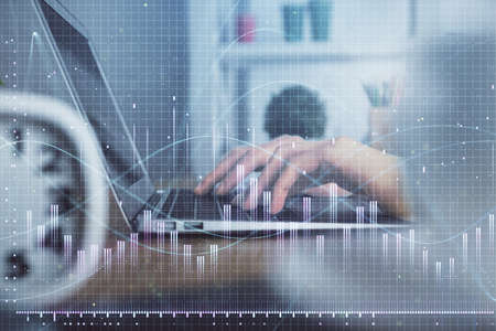 Double exposure of woman hands typing on computer and forex chart hologram drawing. Stock market...