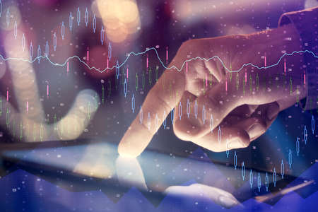 Multi exposure of mans hands holding and using a phone and financial chart drawing. Market analysis...