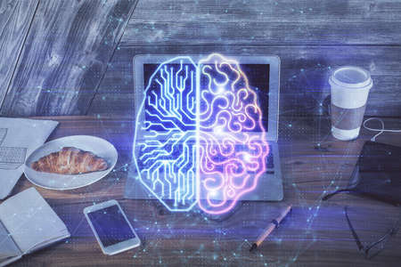 Multi exposure of work table with computer and brain hologram. Brainstorm concept.