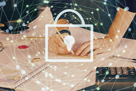 Humans hands with cyber security theme multi exposure background drawings. Concept of online...