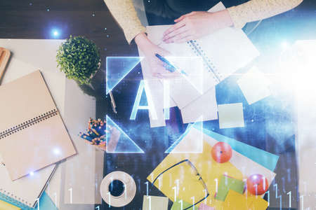 Double exposure of writing hand on background with data solution technology hologram. Ai concept.