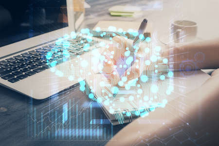 Multi exposure of writing hand on background with brain hologram. Concept of learning.