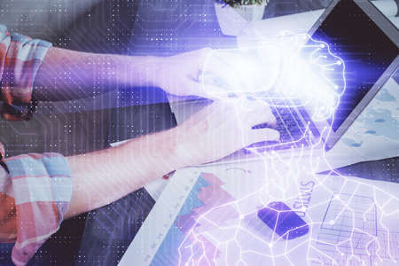 AR hologram with man working on computer on background. Augmented reality concept. Double exposure.の写真素材
