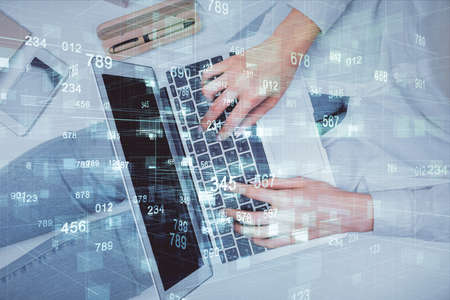 Double exposure of woman hands working on computer and data theme hologram drawing. Top View....