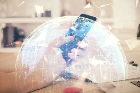 Double exposure of mans hands holding and using a phone and international business theme drawing.の写真素材