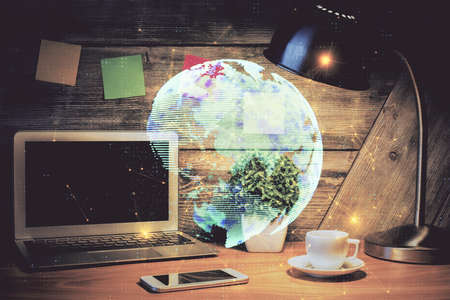 Computer on desktop with social network hologram. Double exposure. Concept of international people...