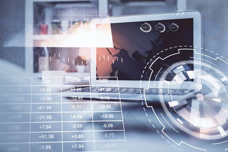 Stock market graph and table with computer background. Multi exposure. Concept of financial...