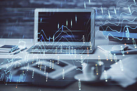 Forex market graph hologram and personal computer on background. Double exposure. Concept of investment.の写真素材
