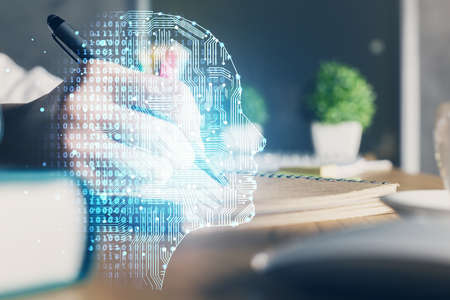 Multi exposure of writing hand on background with brain hologram. Concept of self learning.