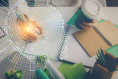 Multi exposure of writing hand on background with brain hologram. Concept of self learning.