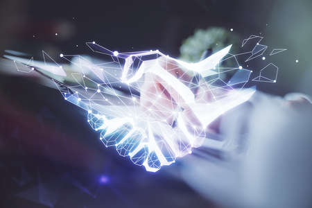 Handshake drawing over hands taking notes background. Concept of success. Double exposureの写真素材