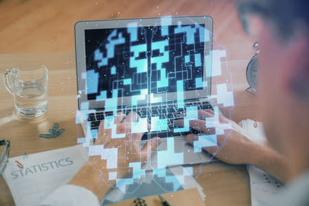 Businessman with computer background with technology theme hologram. Concept of big data. Double...