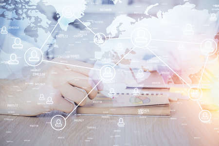 Social network theme hologram with businessman working on computer on background. Concept of world...