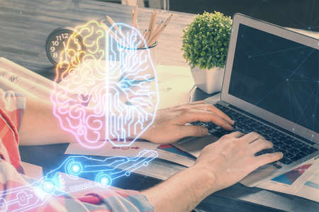 Man with computer background with brain theme hologram. Concept of brainstorm. Double exposure.