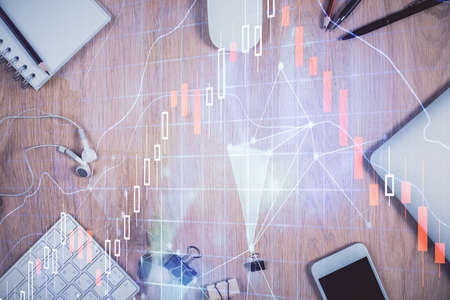 Multi exposure of forex graph hologram over desktop with phone. Top view. Mobile trade platform concept.の写真素材