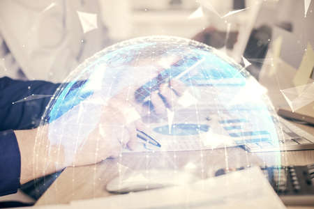 Double exposure of mans hands holding and using a phone and international business theme drawing.の写真素材