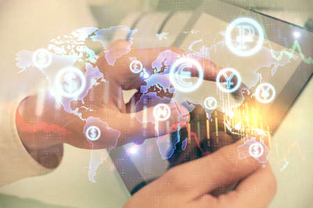 Multi exposure of mans hands holding and using a phone and financial chart drawing. Market analysis...