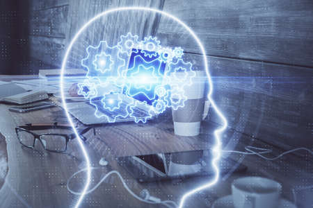 Multi exposure of work table with computer and brain hologram. Brainstorm concept.の写真素材