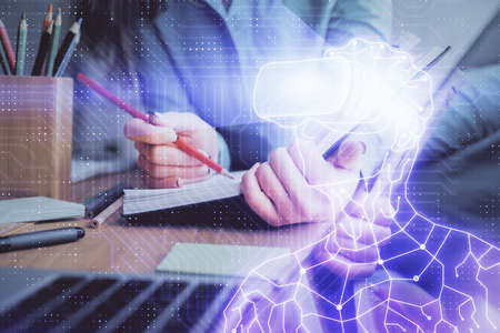 AR hologram over hands taking notes background. Concept of augmented reality. Double exposure