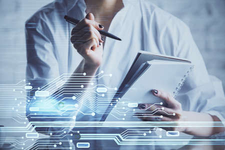 Multi exposure of hands making notes with digital coding icons. Computer learning concept.