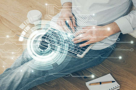 Multi exposure of data internet theme hologram with man working on computer on background. Concept...