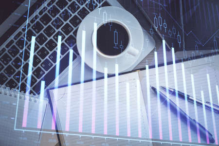 Stock market chart and top view computer on the table background. Double exposure. Concept of financial analysis.の写真素材