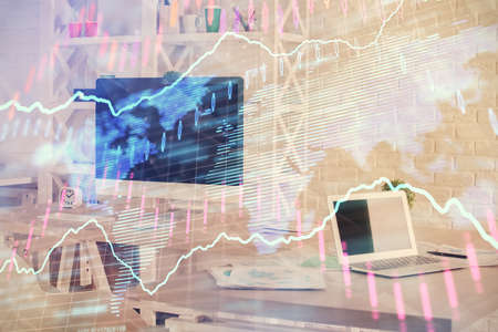 Double exposure of financial graph drawing and office interior background. Concept of stock market.