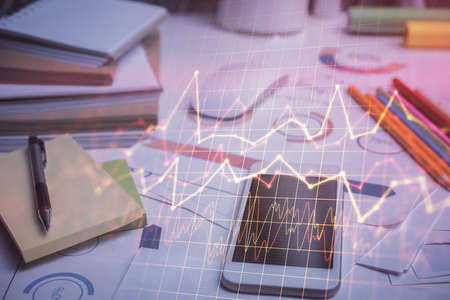Double exposure of forex chart drawing and cell phone background. Concept of financial data analysis