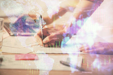 Multi exposure of woman hands typing on computer and financial chart hologram drawing. Stock market...