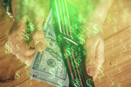 Multi exposure of forex graph drawing hologram and USA dollars bills and man hands. Technical...