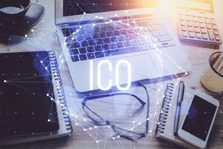 Double exposure of blockchain and crypto economy theme hologram and table with computer background....