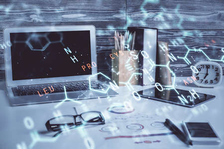 Desktop computer background and formula hologram writing. Double exposure. Education concept.の写真素材