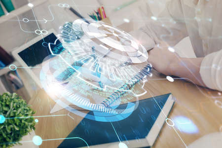 Multi exposure of woman hands on background with technology coding hologram. Data concept.
