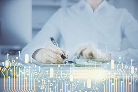 Multi exposure of hands making notes with digital coding icons. Computer learning concept.