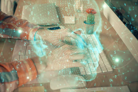 Man typing on keyboard background with brain hologram. Concept of big Data. Double exposure.