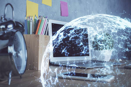 Computer on desktop with social network hologram. Double exposure. Concept of international people connections.の写真素材