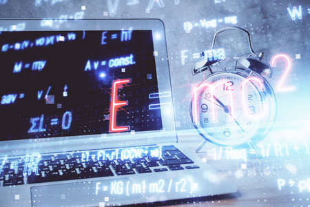 Desktop computer background and formula hologram writing. Double exposure. Education concept.