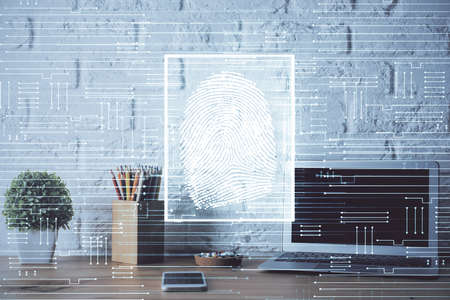 Computer on desktop in office with finger print drawing. Double exposure. Concept of business data...