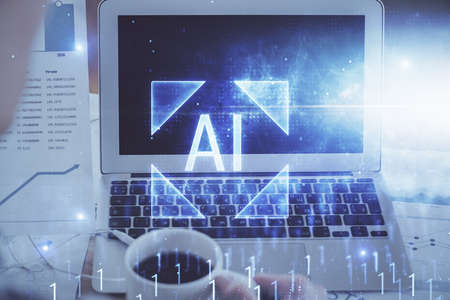 Double exposure of laptop computer and technology theme hologram. Concept of freelance work.の写真素材
