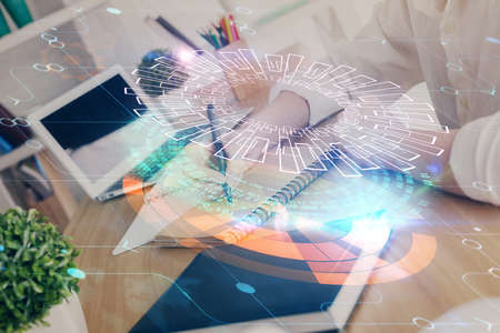 Multi exposure of woman hands on background with technology coding hologram. Data concept.の写真素材