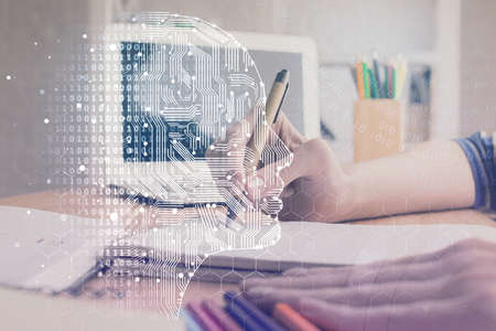 Multi exposure of writing hand on background with brain hologram. Concept of self learning.