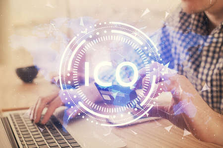 Double exposure of man hands holding a credit card and crypto business theme drawing. Digital blockchain and E-commerce concept.の写真素材